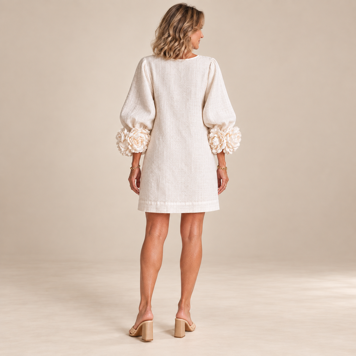 Rosalie Button-Down Mini Dress in White, worn by a mature woman