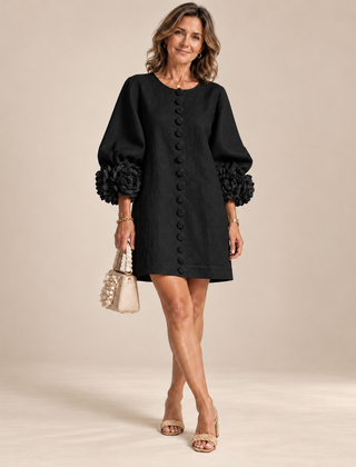 Rosalie Button-Down Mini Dress in Black, worn by a mature woman
