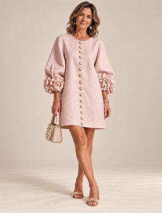 Rosalie Button-Down Mini Dress in Pink, worn by a mature woman